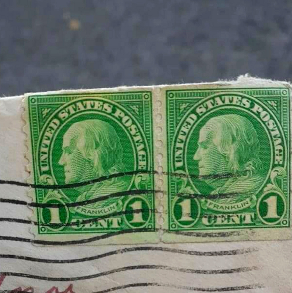 2 1c Benjamin Franklin stapms connected.